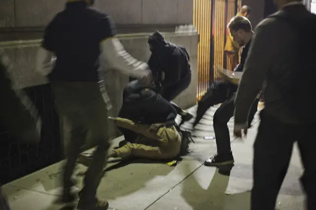 A Proud Boy kicking a protester outside the Metropolitan Republican Club on Friday night